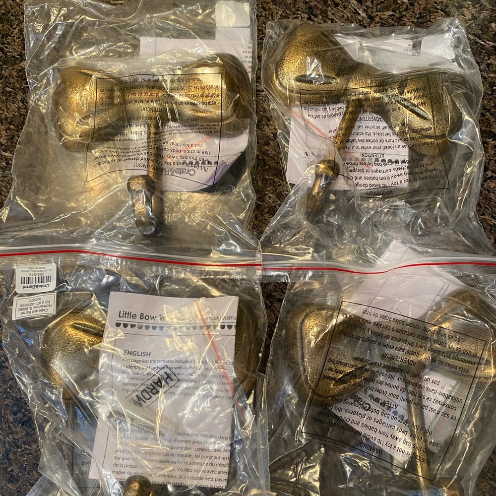 Crate & Barrel set of 4 bow wall hooks